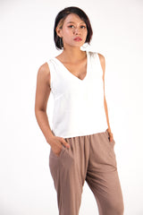 closeup of the sleeveless Nuon top in cream featuring a flattering v neckline