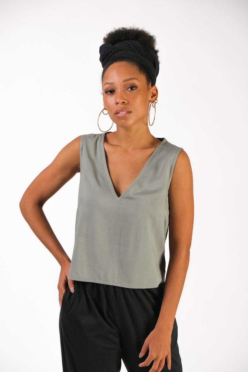 Closeup front view of tonlé's Nuon top in moss rayon